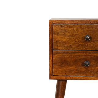 Close detail showing the rich chestnut wood grain, two drawers, and metal circular knobs.