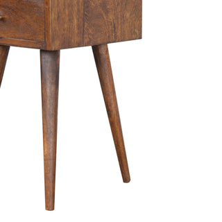 Close-up showing the tapered legs and the chestnut wood grain at the base of the bedside unit.