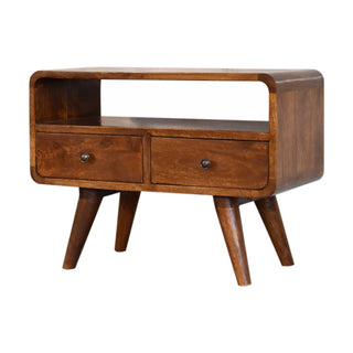Angled view showing the deep chestnut wood grain, two drawers, open shelf, and tapered legs.