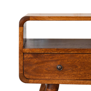 Close-up detail of the chestnut unit showing the curved edges, open shelf, and drawer with a metal knob.
