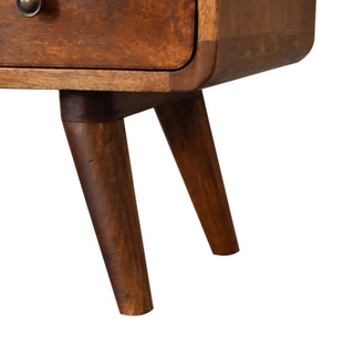 Close-up detail showing the tapered, angled wooden legs attached to the curved corner of the chestnut media unit.