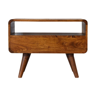 Front view of the chestnut media unit, highlighting the large open shelf and solid drawer panel.