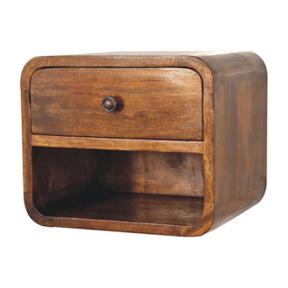 Floating dark wood bedside unit featuring a single drawer and a curved, recessed open storage compartment below.