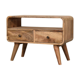 Angled view highlighting the curved corners, natural wood grain, and small antique brass drawer knobs.
