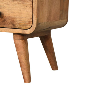Close detail of the curved base and tapered wooden legs of the media unit.