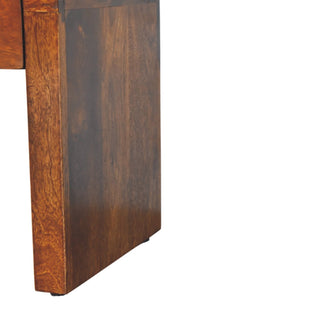 Detail of the nightstand's lower side panel, showing the wood grain and protective foot pad.