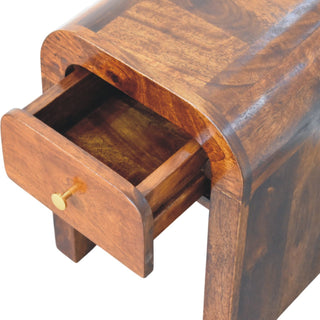 Close view of the chestnut nightstand with the single drawer partially open, showing the interior construction.