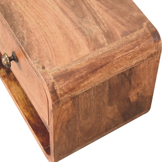 View from above showing the rich wood grain on the top panel and the smooth, rounded front corner.