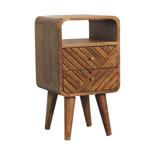 Curved wooden bedside table featuring an open storage cubby and two drawers with diagonally carved fronts.