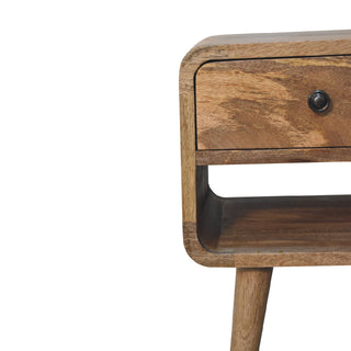 Right side detail of the oak-ish bedside table highlighting the curved edges and natural wood grain.
