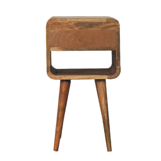Full front view of the oak-ish bedside table showing the closed drawer, open shelf, and two tapered wooden legs.