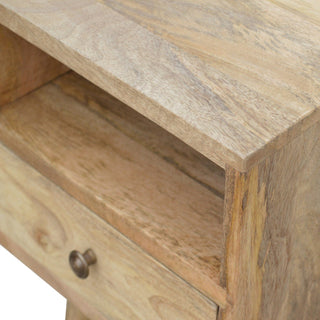 Close-up of the light mango wood top surface, corner joint, and open storage shelf.