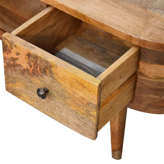 Close-up of the entertainment unit showing one drawer pulled open, revealing the interior storage space and construction.