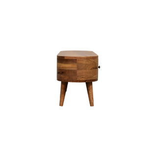 End view of the rounded wooden entertainment unit, showing the depth and tapered legs.