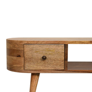 Detail of the unit's rounded edge, showing the drawer, dark knob, and tapered leg top.