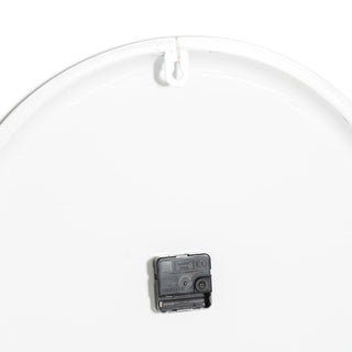 Rear view of the white wall clock showing the battery compartment and hanging bracket.