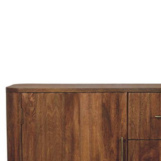 Detail of the sideboard's rounded corner, wooden top, and vertical wood grain on the cupboard door.