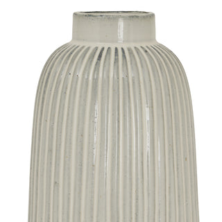 Upper section of the ceramic vase showing the curve, vertical ribbing, and speckled glaze.