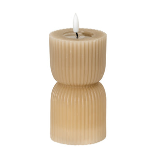 Stone carved LED candle with vertical fluting and a constricted centre, lit, on a white background.