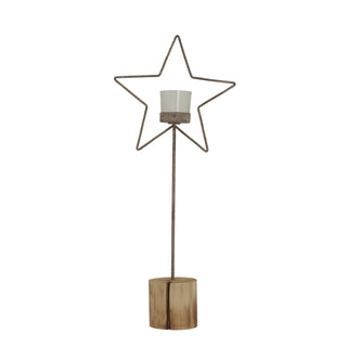Rustic metal wire star candle holder with glass votive cup, mounted on a tall stem and natural wooden log base.