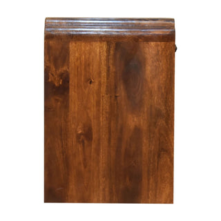 Straight side view of the dark wood bedside cabinet showing the vertical grain and curved top edge profile.