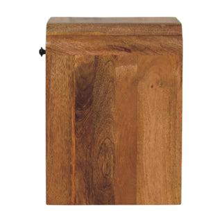 Side profile view of the oak-ish nightstand, showing the thick wood construction and curved top edge.