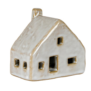 Front-on angled view highlighting the glossy, rustic white glaze texture and chimney detail.