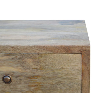 Detail shot of the cabinet top surface and front edge, highlighting the corner joint and wood texture.