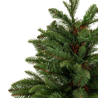 Close-up detail of the dense artificial fir needles and branches, showing the integrated green lighting cable.