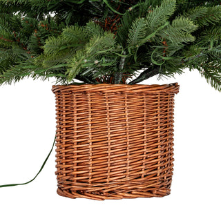 Woven brown rattan pot base detail, showing the texture of the weave and the green electrical cable.