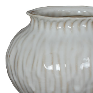 Close-up of the vase shoulder, showing the vertical ribbing and glossy glaze finish.