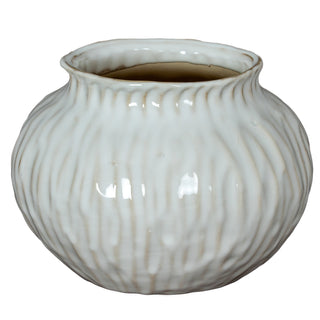 Squat white ceramic vase with a textured, vertically ribbed surface and a flared rim.