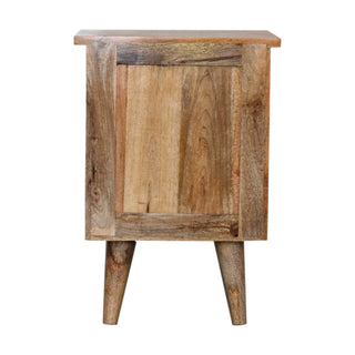 End view of the bedside cabinet displaying the panelled construction, varied wood grain, and tapered legs.
