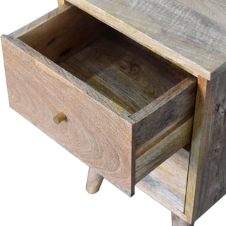 Close-up of the bedside table showing the top drawer pulled open, revealing the internal construction and wood grain.