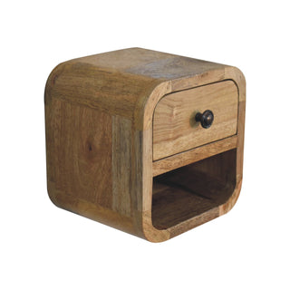 Close angled view showing the light oak-ish wood grain, rounded corners, and compact box shape.