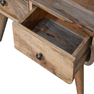 Close detail of the media unit showing one drawer fully open, revealing the interior and wood grain.