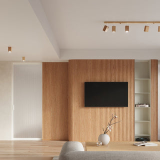 Oak KEKE 2 ceiling light above a slatted oak media wall in a modern sitting room.