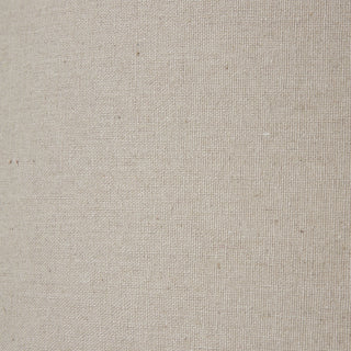 Close-up detail of the coarse, natural weave of the beige linen lamp shade fabric.