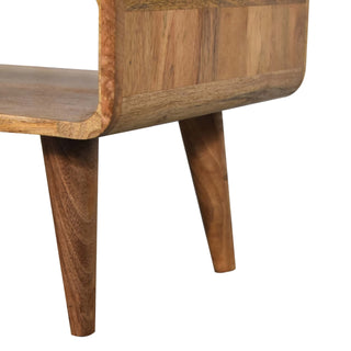 Detail of the curved wooden joint connecting the shelf and side panel, showing the two angled legs.