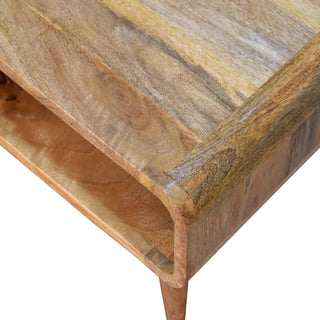 Close-up showing the varied wood grain and colour across the top surface and the smooth, rounded corner joint.