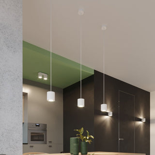 Orbis 2 double ceiling lamp surface-mounted on a green ceiling section in a modern kitchen setting.