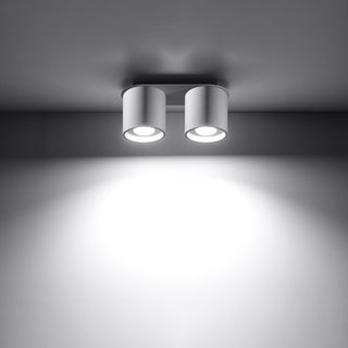 Functional view of the white ceiling light casting a strong, focused beam downwards.
