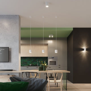 Modern kitchen scene showing cylindrical lights used as ceiling spotlights, pendants, and wall sconces.