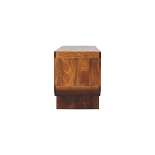 End profile of the curved chestnut media unit, showing the thick construction and wood grain patchwork.