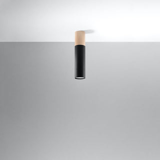 Angled view of the cylindrical ceiling light with wood and black sections, mounted on a white ceiling.