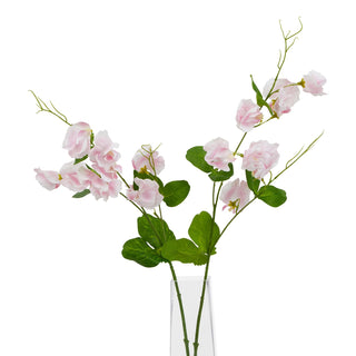 Two pale pink artificial sweetpea stems featuring green leaves and tendrils, displayed in a clear glass vase.