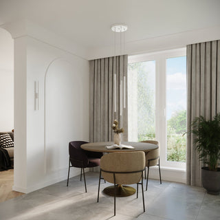 Styled room scene showing three white cylindrical lights over a dining nook with an arched doorway.