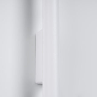 Close up detail of the textured white cylindrical body and mounting plate junction.