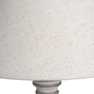 Close-up detail of the neutral fabric lampshade texture, showing the weave and natural flecks.