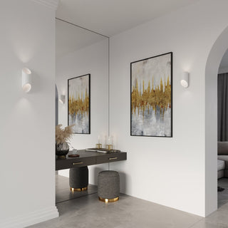 Two white wall lamps flanking a painting in a modern hallway setting with a console table and mirror.